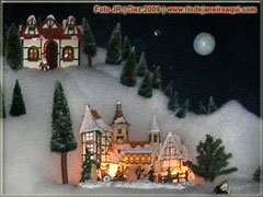 Miniatura natalina de chales na neve